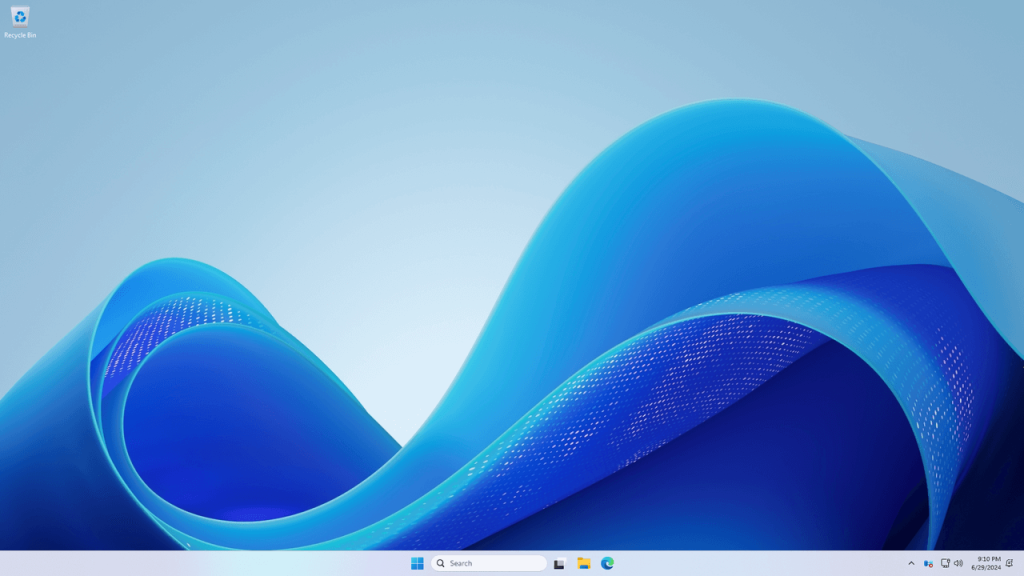 Windows Server 2025 desktop with blue abstract wave background, "Recycle Bin" icon, taskbar showing search, and system tray 