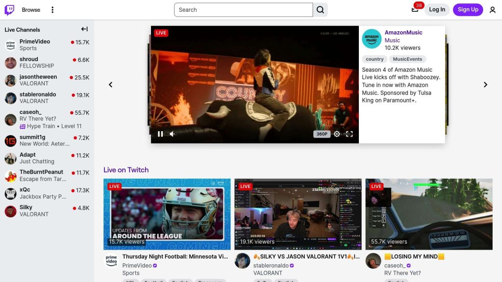 Twitch interface showing live channels, including PrimeVideo sports and Amazon Music event. Featured video with performer on stage.