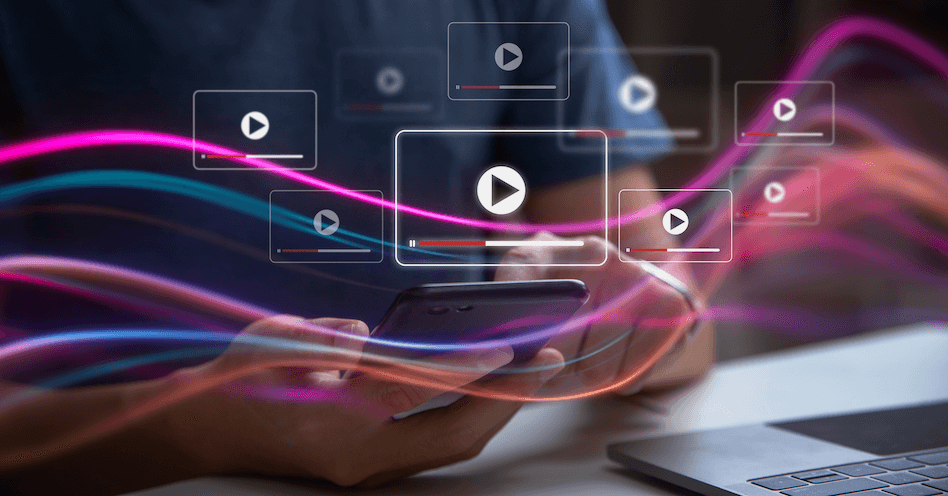 Person holding a smartphone with multiple digital play icons and colorful wave lines, suggesting streaming or video content.