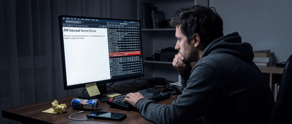 Man in hoodie at desk, looking at computer screen displaying "500 Internal Server Error" message, with code on the side.