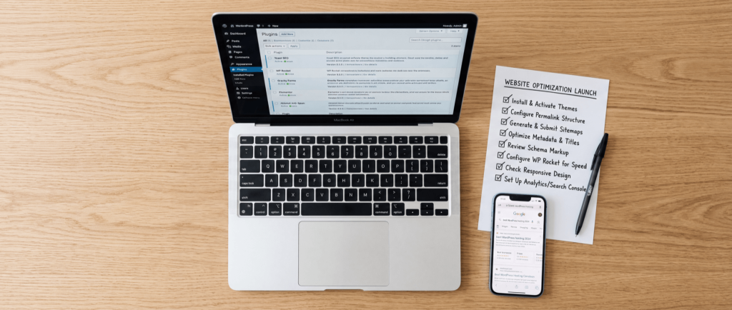 Laptop displaying WordPress dashboard, smartphone with Google search, and checklist titled "Website Optimization Launch" on wooden desk.